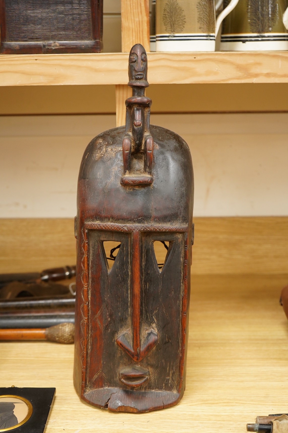 An African carved wood tribal Dogon mask, 49cm high